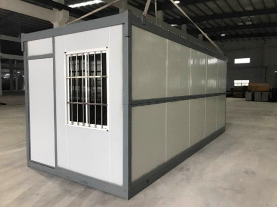 Foldable container office being unfolded on a construction site